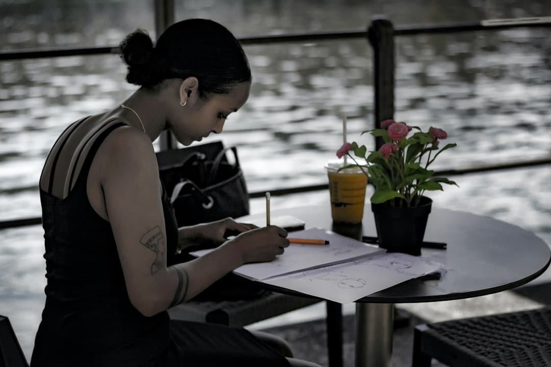 Woman journaling and reflecting in a peaceful setting